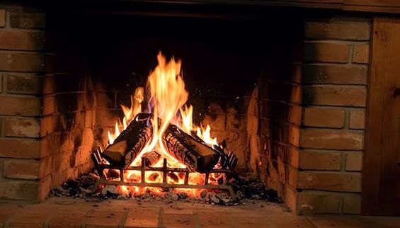 Log fire burning steadily in a brick-lined firebox